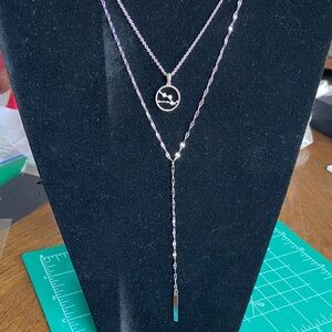 Bundle of 2 sterling Necklaces. 1 adjustable lariat and 1 diamond chip stars